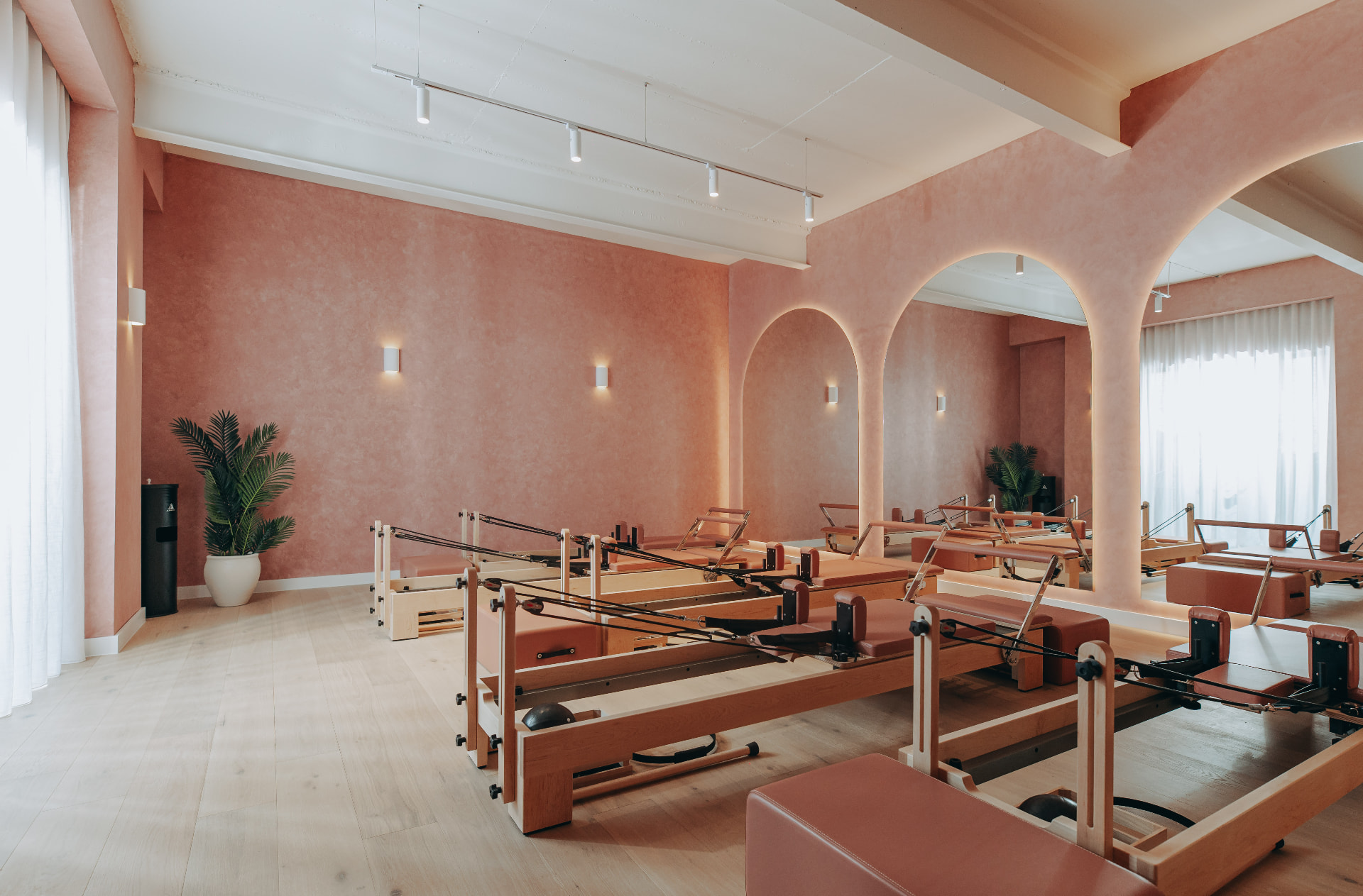 POSÉ Pilates reformer studio in Mosman with terracotta walls, arched mirrors and custom reformers